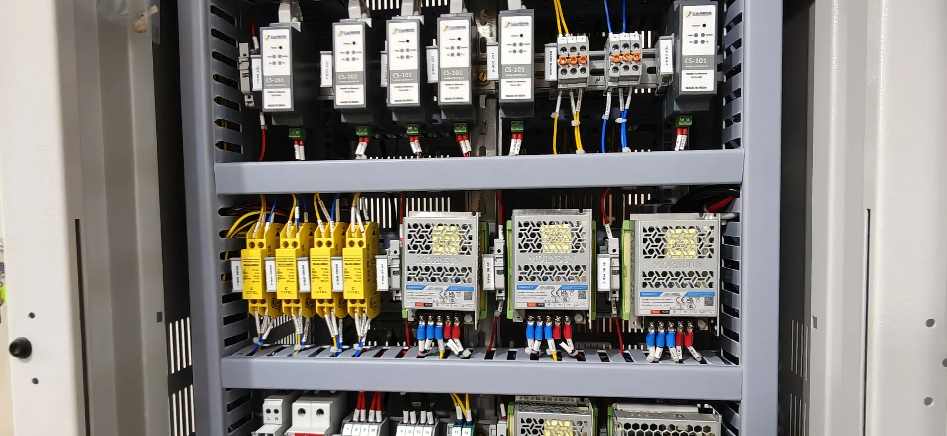 An open EnerMAN panel cabinet: rows of EnerMAN units and wiring